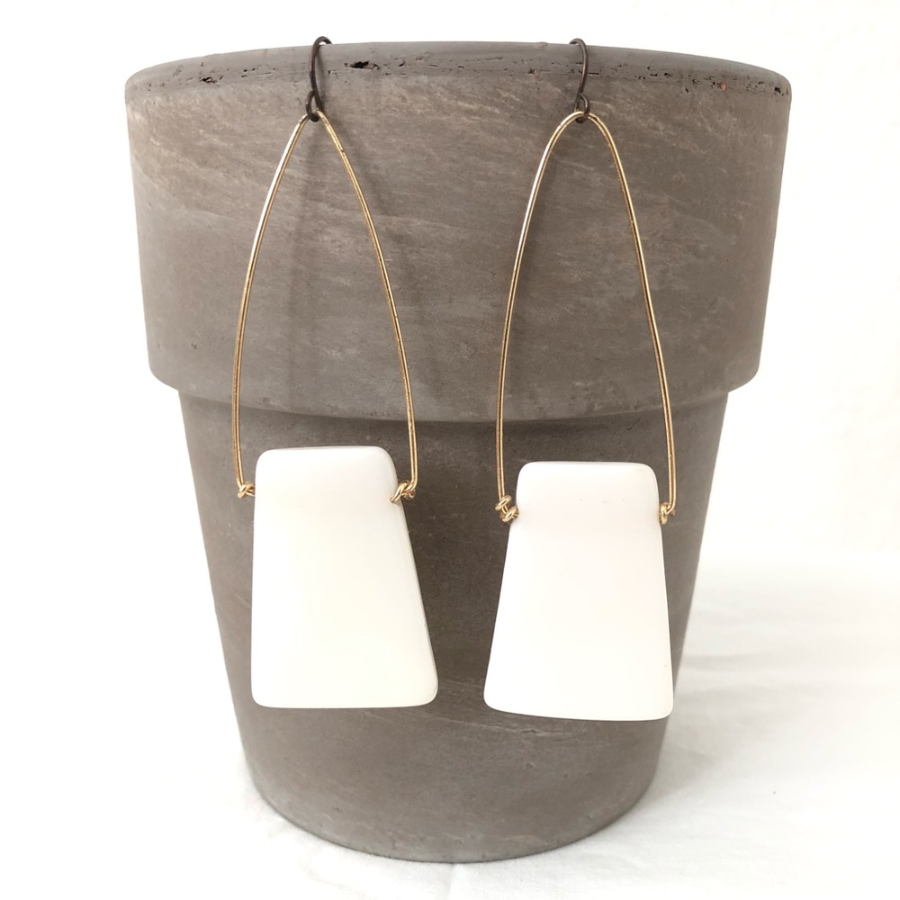 Long cream & gold colored earrings